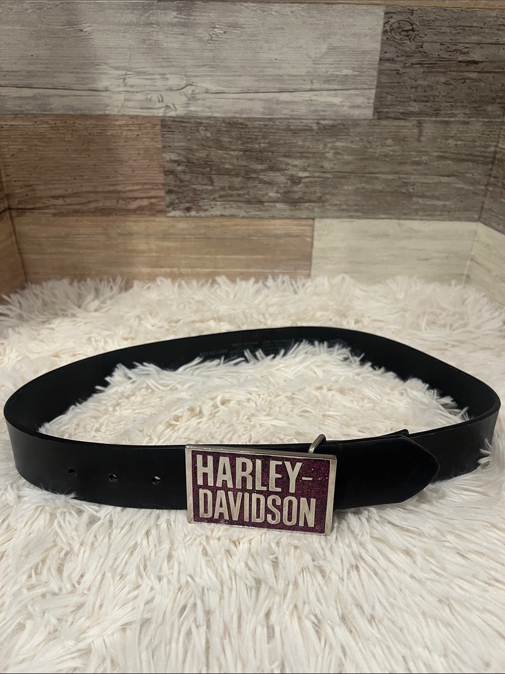 Harley Davidson black belt, with pink Harley Davidson belt buckle.